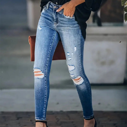 Jeans skinny strappati lavati retrò elasticizzati a vita alta da donna